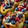 Baked Pears with Berries, Honey, Walnuts & Blue Cheese