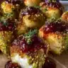 Pistachio Crusted Brie Bites with Raspberry Honey Glaze