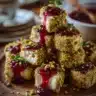 Pistachio-Crusted Brie Bites with Raspberry Honey Glaze
