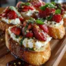 Crostini with Whipped Brie, Roasted Strawberries, Black Pepper & Hot Honey Basil Drizzle Image
